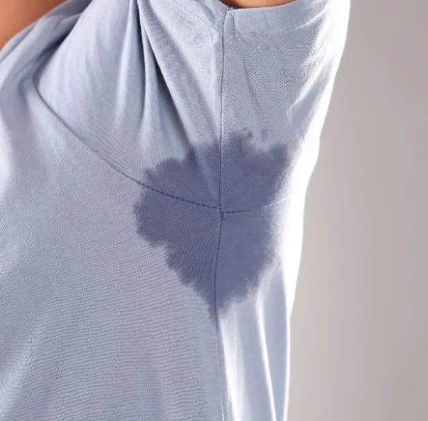 Before: a visible underarm sweat patch on a shirt